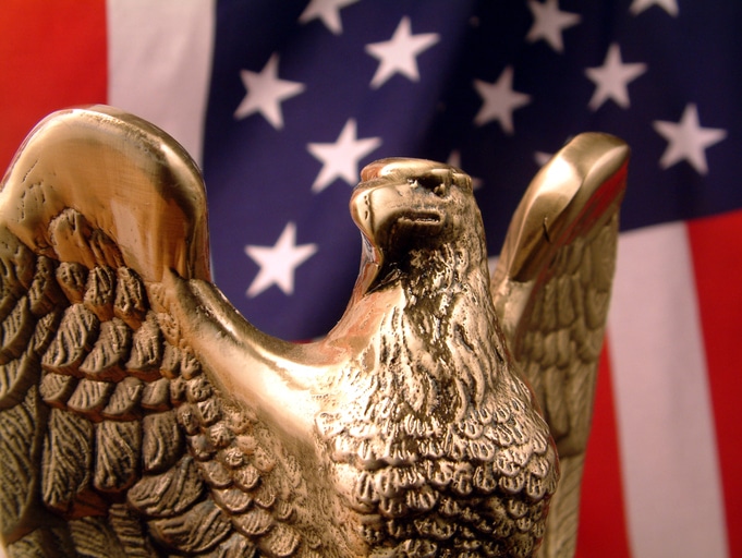 Bronze Eagle in front of American Flag