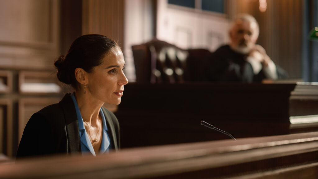Court of Law and Justice: Portrait of Beautiful Female Victim Giving Heartfelt Testimony to Judge, Jury. Emotional Speech of Empowered Woman against Crime, Injustice, Prejudice, Corruption Court of Law and Justice: Portrait of Beautiful Female Victim Giving Heartfelt Testimony to Judge, Jury. Emotional Speech of Empowered Woman against Crime, Injustice, Prejudice, Corruption