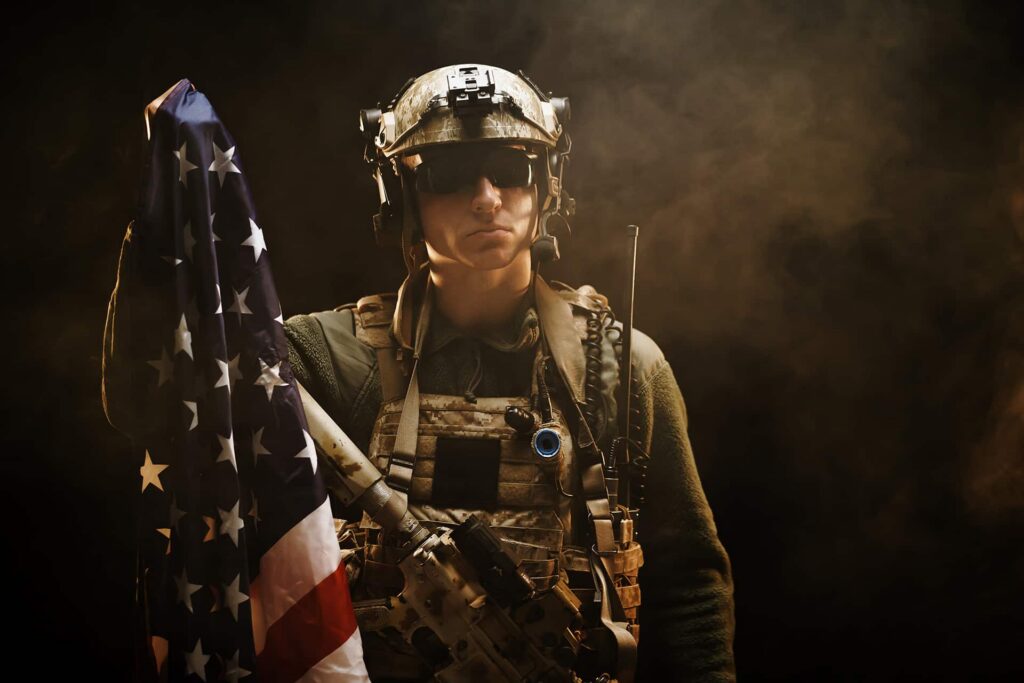 thoughtful-soldier-holding-american-flag-in-studio-2026-03-23-23-52-23-utc.jpg
